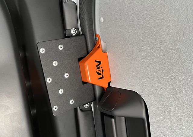 Anti-peel bracket fitted inside a van door frame